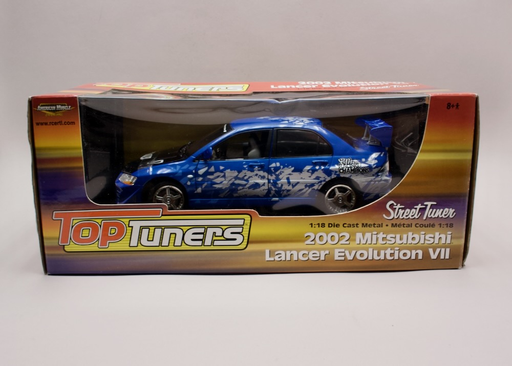 Mitsubishi Lancer Evolution VII 2002 Top Tuners 1:18 Ertl 36700 – zapáskovaný nevystavený model v originálním balení